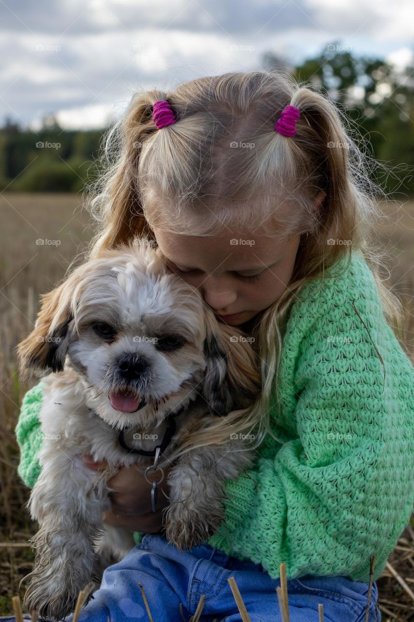 little girl and her puppy . love and care for each other. Love for their pels ❤️🧡💛💚💙💜
