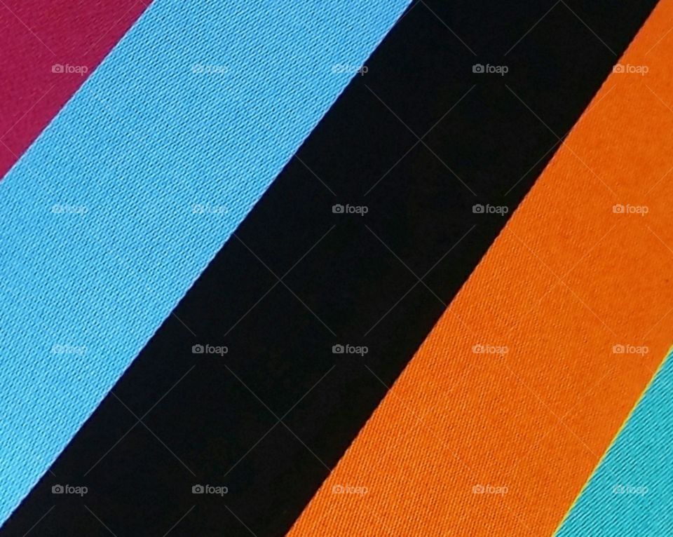 Diagonal lines of black turquoise orange burgundy and teal I love these colors