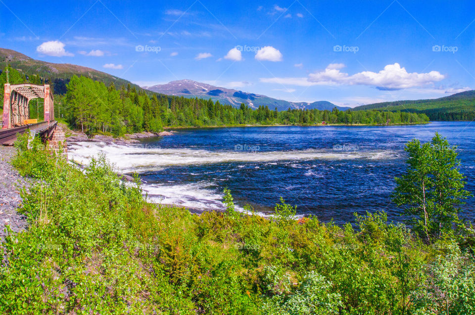 Streaming water with a mountains