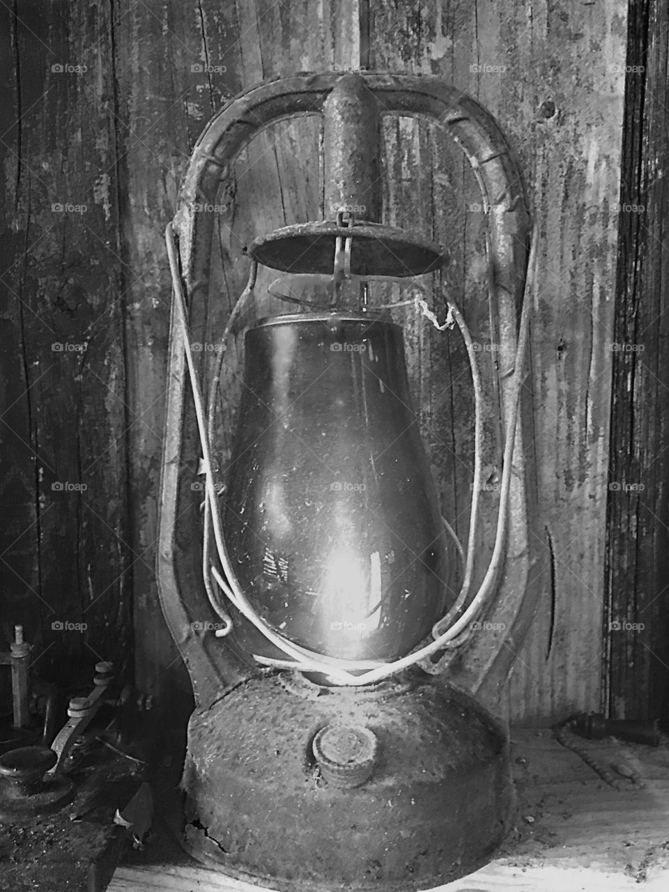 Rustic antique lantern in an old barn.