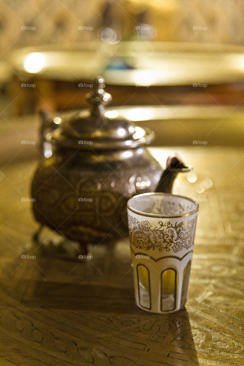 Tea pot with drinking glass