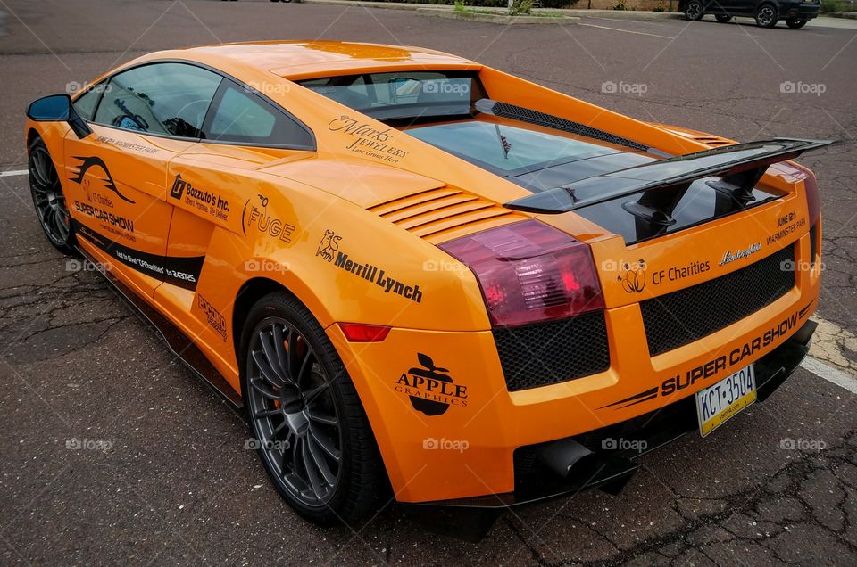 Angled View of Orange Lamborghini from Rear Driver's Side