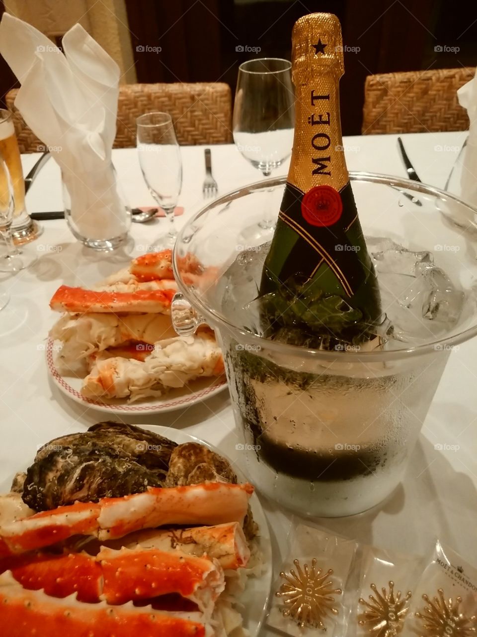 celebration by sparkling wine moet and crabs and seafoods.