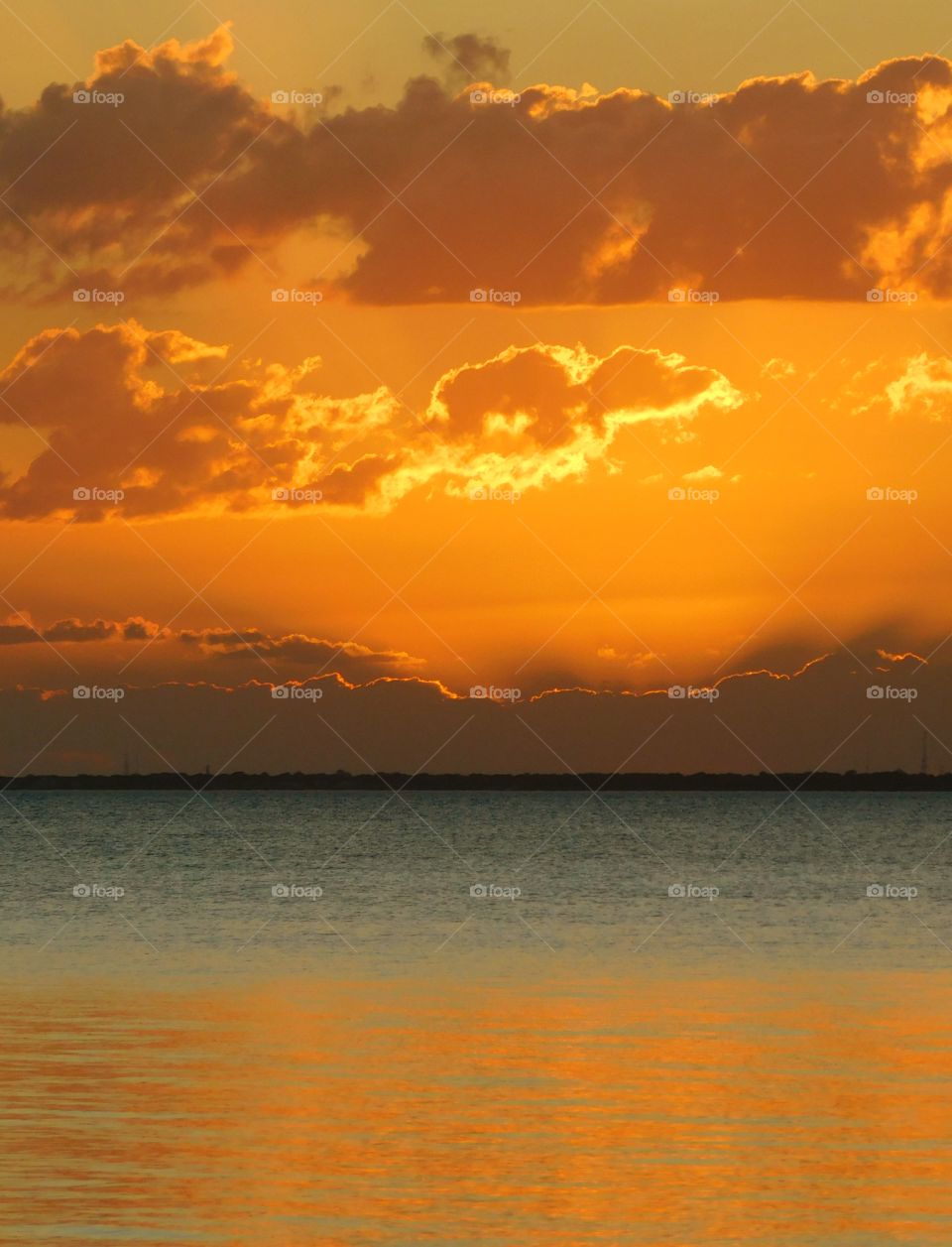 Amazing Silhouettes! The sun is like a great big romantic, inspirational fire in the sky. Brilliant streaks of yellow, orange, gold, overcome the spacious sky. The sky resembled a prism; all the colors blended perfectly together. It's as if the colors and intensity of the light is just right!