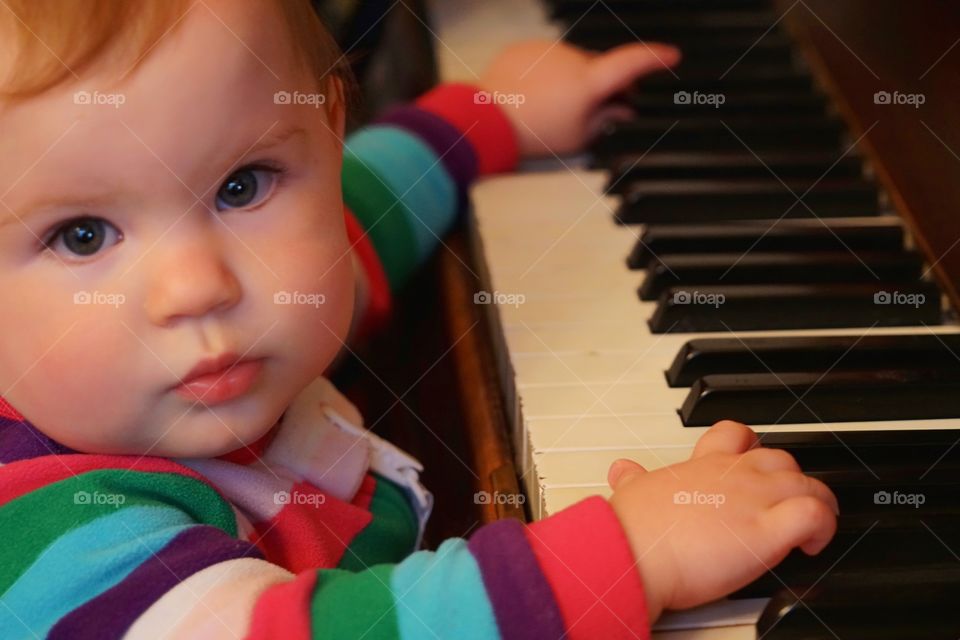 Baby Girl Playing Piano
