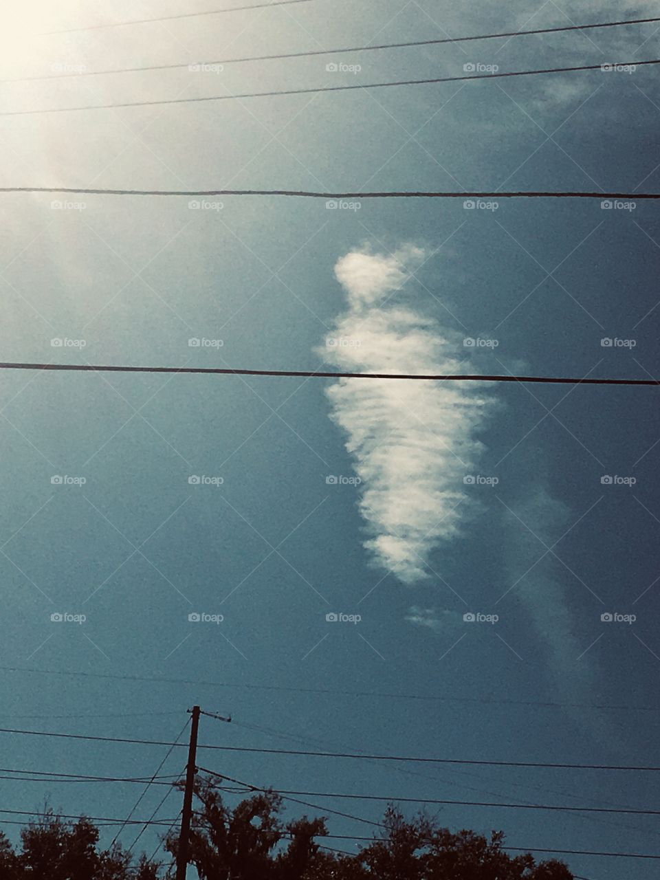 Skeleton mermaid clouds in the sky