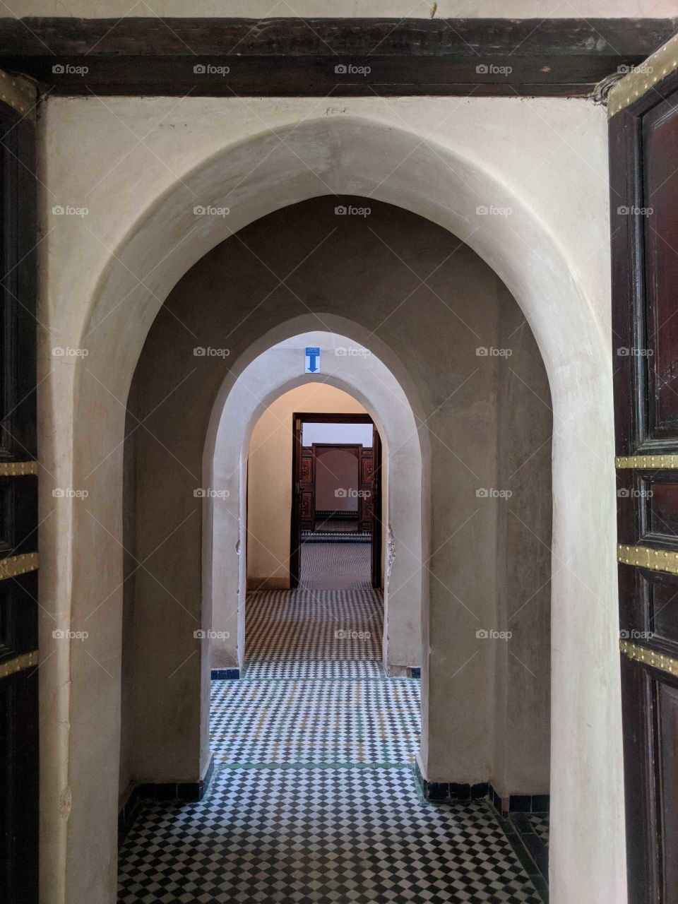 Row of Nested Arches (Entrances) Surrounded by Heavy Wood Doors and on Colorful Ceramic Tile Mosaic Floors in the Bahia Palace in Marrakech in Morocco