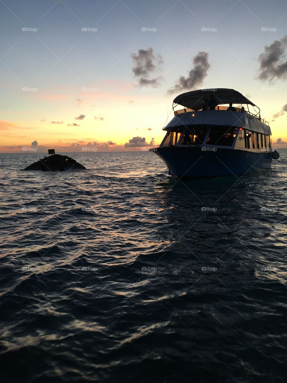 A glass-bottom tour boat checking out the HMS Vixen Shipwreck in Bermuda. Taken July 28th, 2016. No filter. Photographed from within the Bermuda Triangle. 