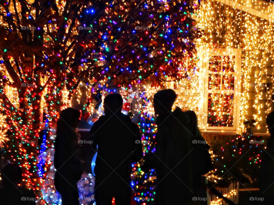 Enjoying Neighborhood Christmas Light Display At Night