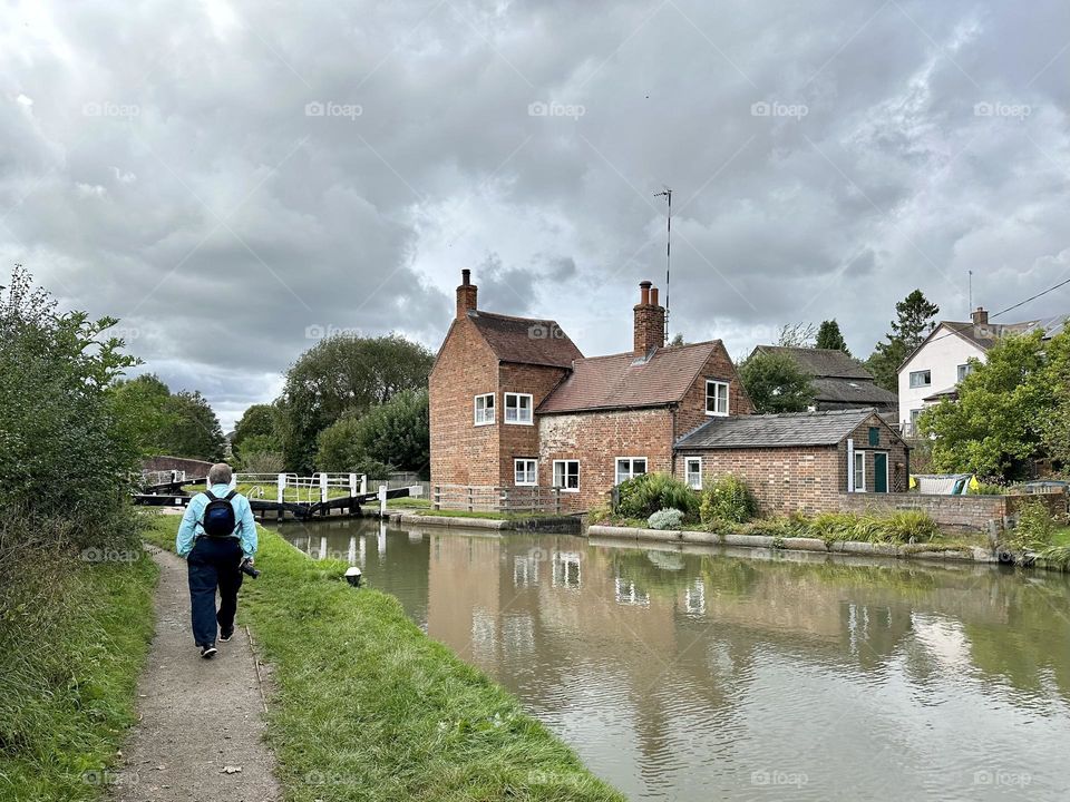 Father walking along the towpath near the Braunston locks canal life England Father’s Day summer vacation cloudy sky