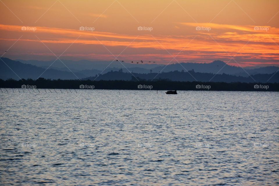 Sun rises on the way to Cheduba Island in the Bay of Bengal close to Ramree Island, belongs to Myanmar,
