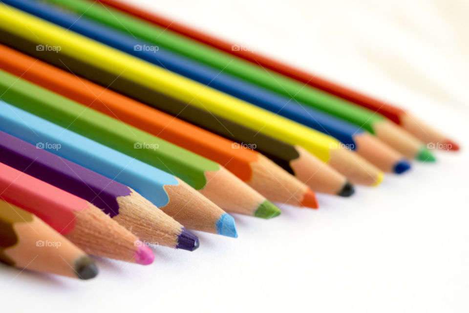 View of colored pencils on white background