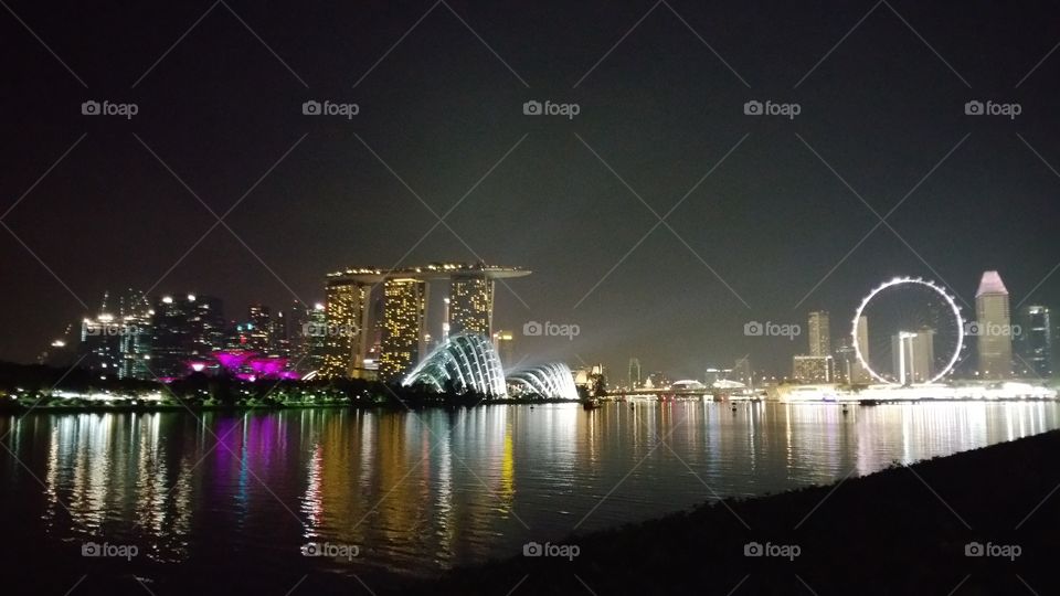 Spectacular night view of Singapore city. Supertree Grove, gardens by the bay, Singapore Flyer, Marina Bay Sands.