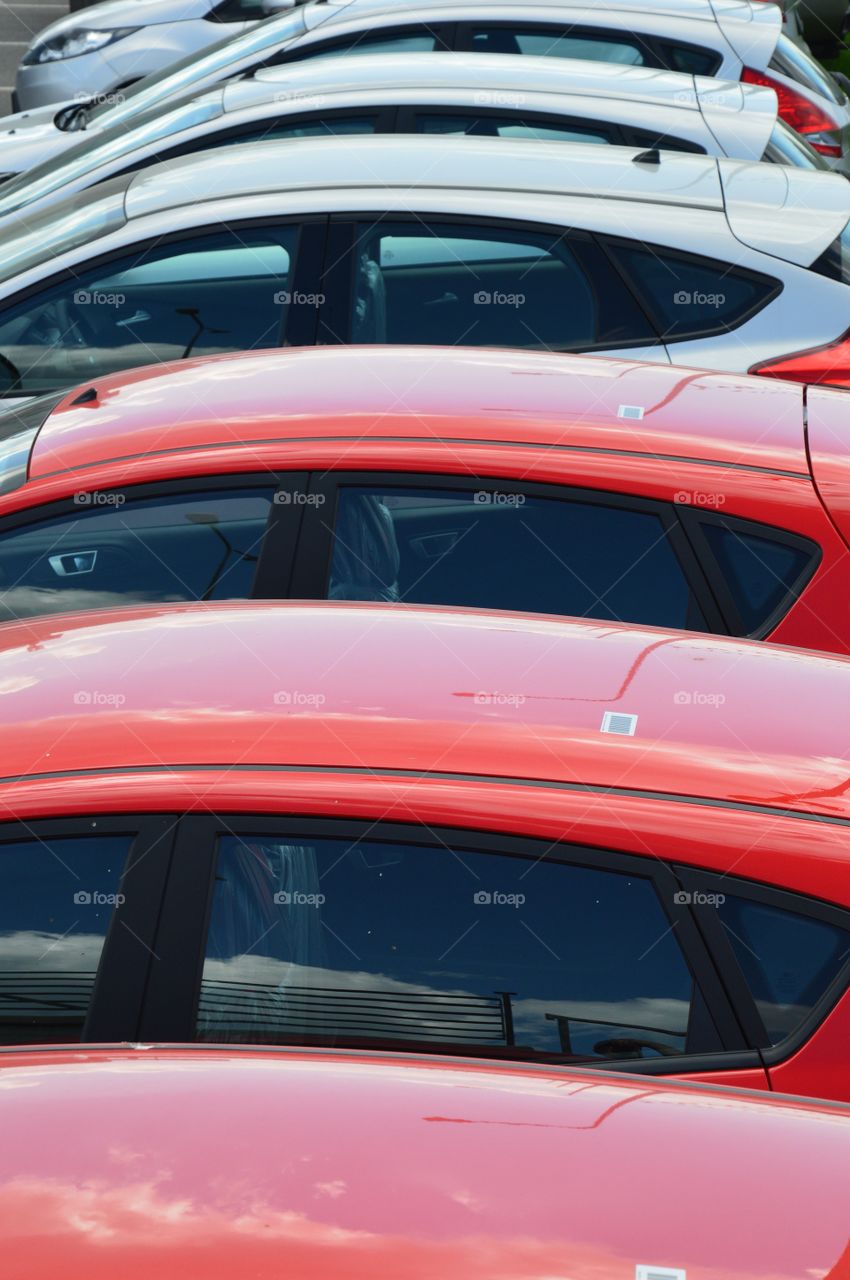 row of red and gray cars