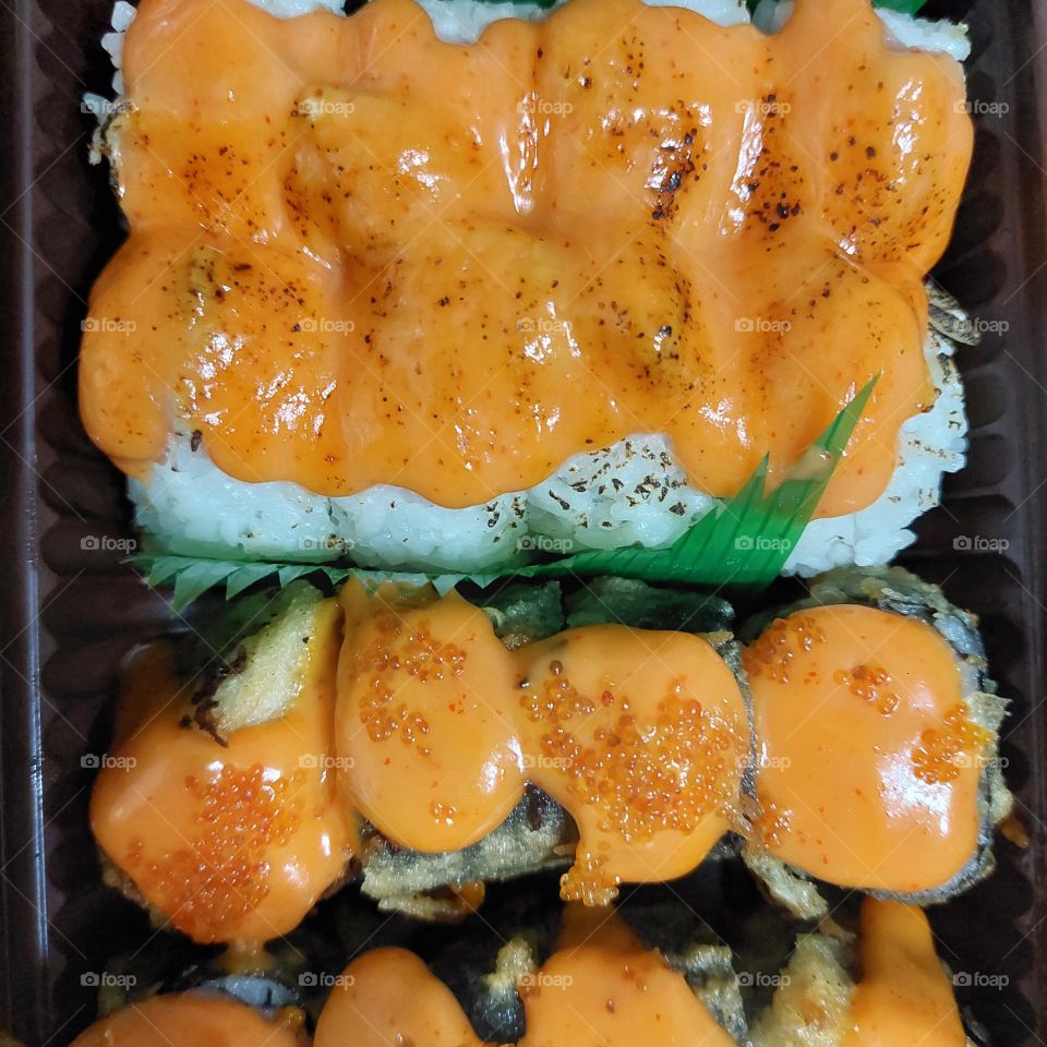 assorted sushi served in a container