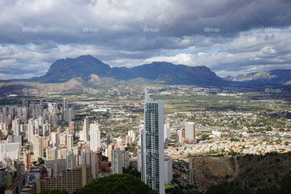 City#skyscrapper#urban#mountains#sky#clouds#view