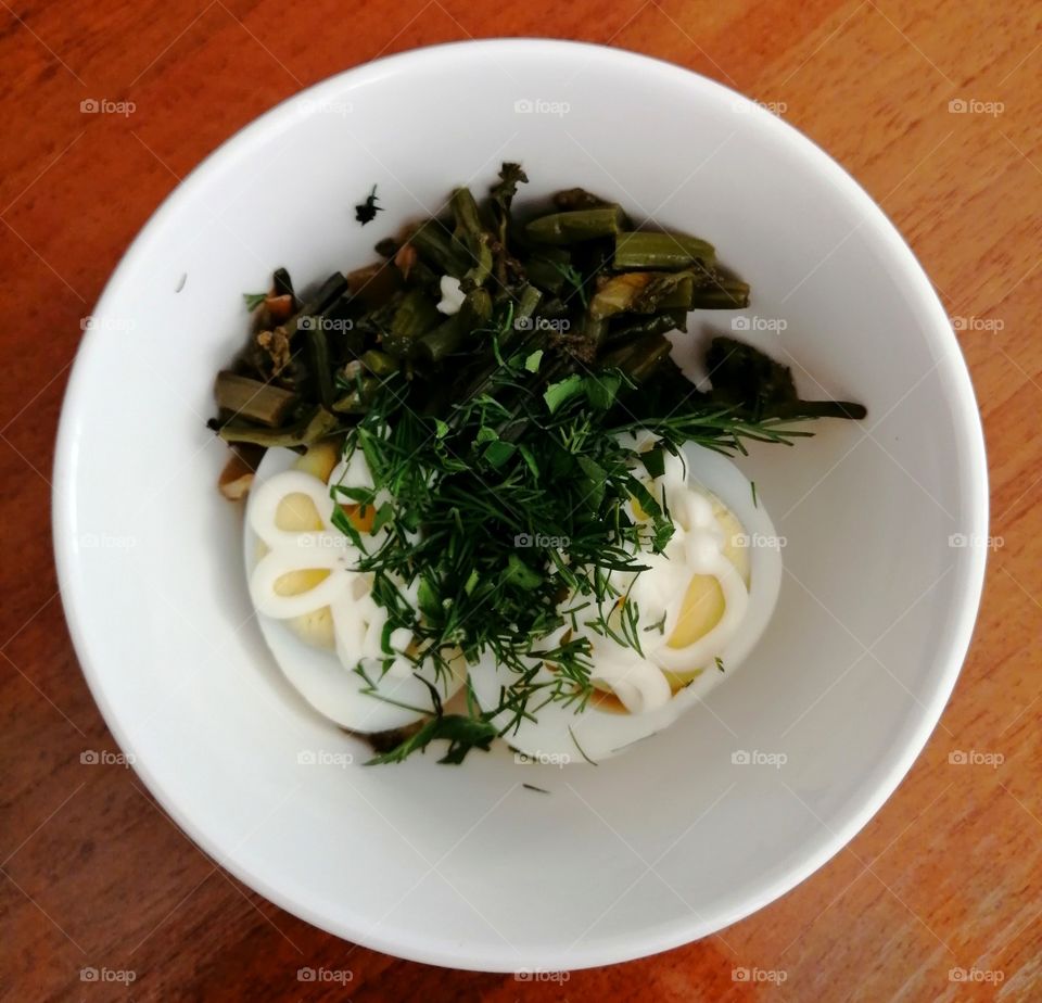 Salad with egg, fern, greens and mayonnaise