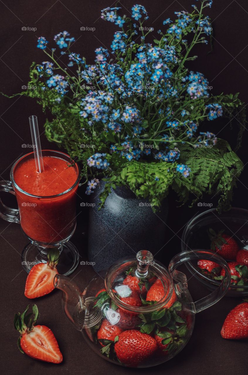 still life of strawberries and smoothies, with forget-me-nots