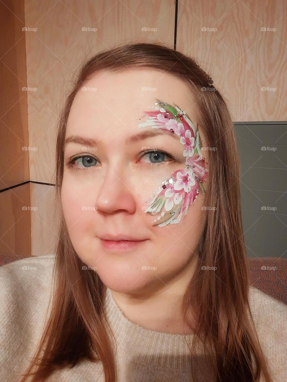 Woman with art of flowers on face eyes 