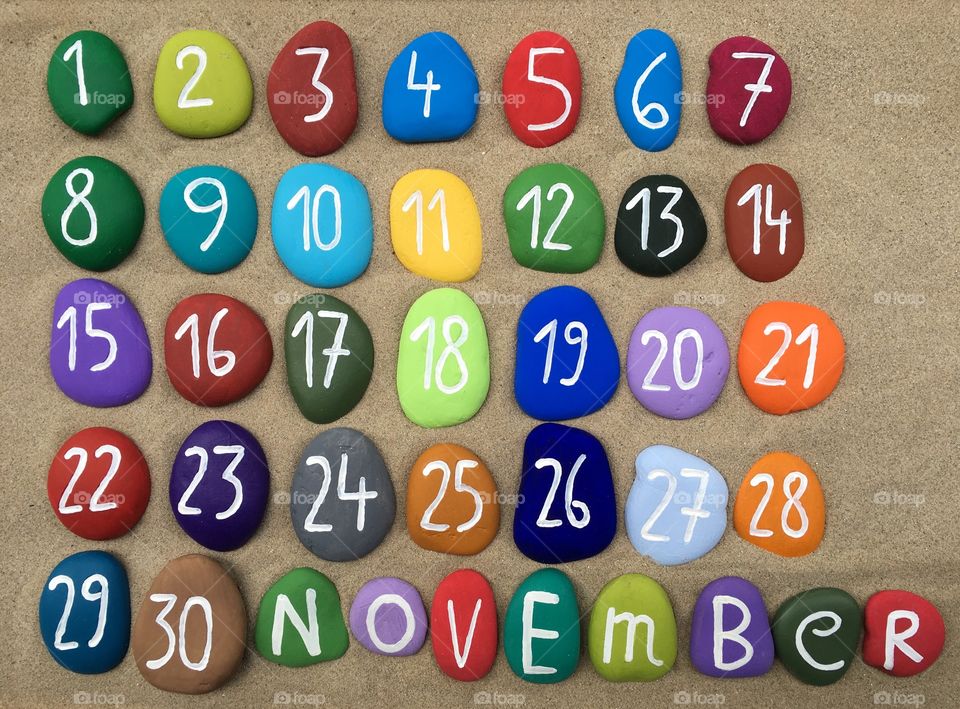 November calendar on colored stones