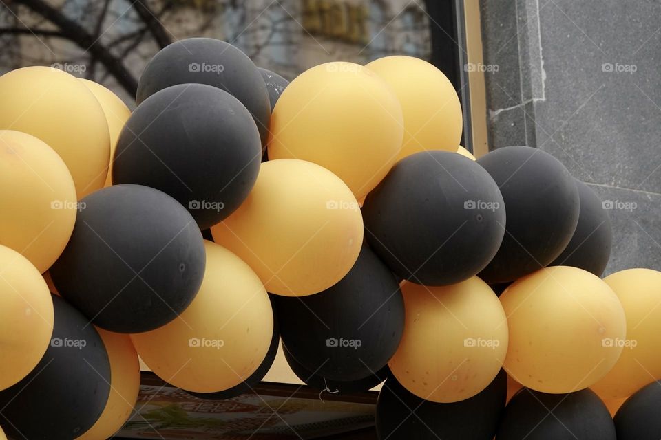 Group of yellow and black balloons. Holiday, congratulation, concept, close-up.