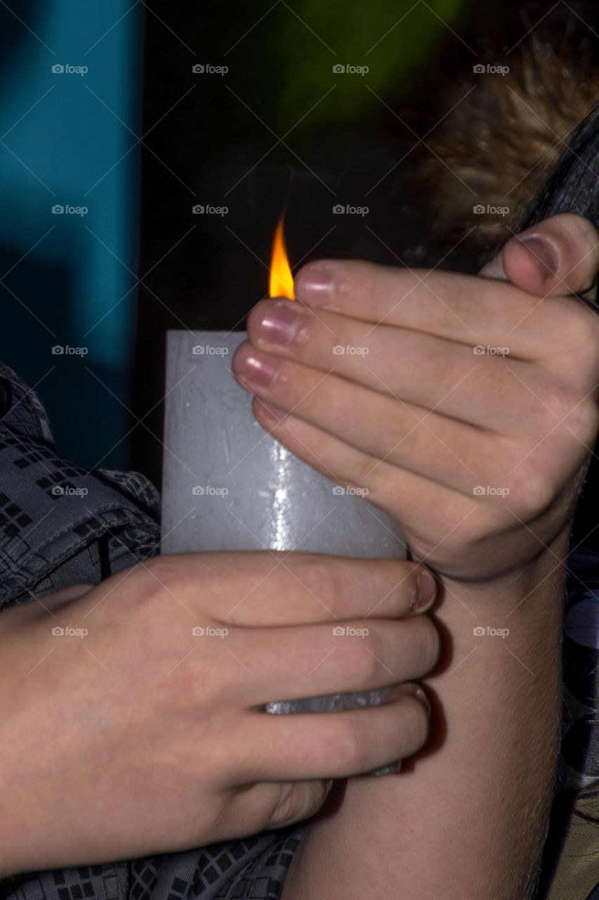 A candle in a child’s hand