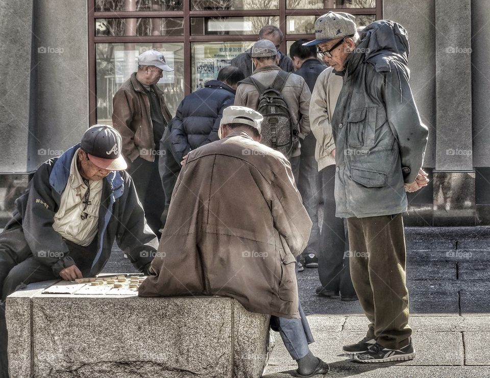 Old men playing games in a park