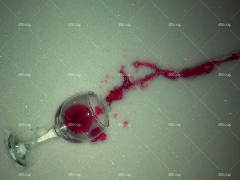 spilled red wine on the snow
