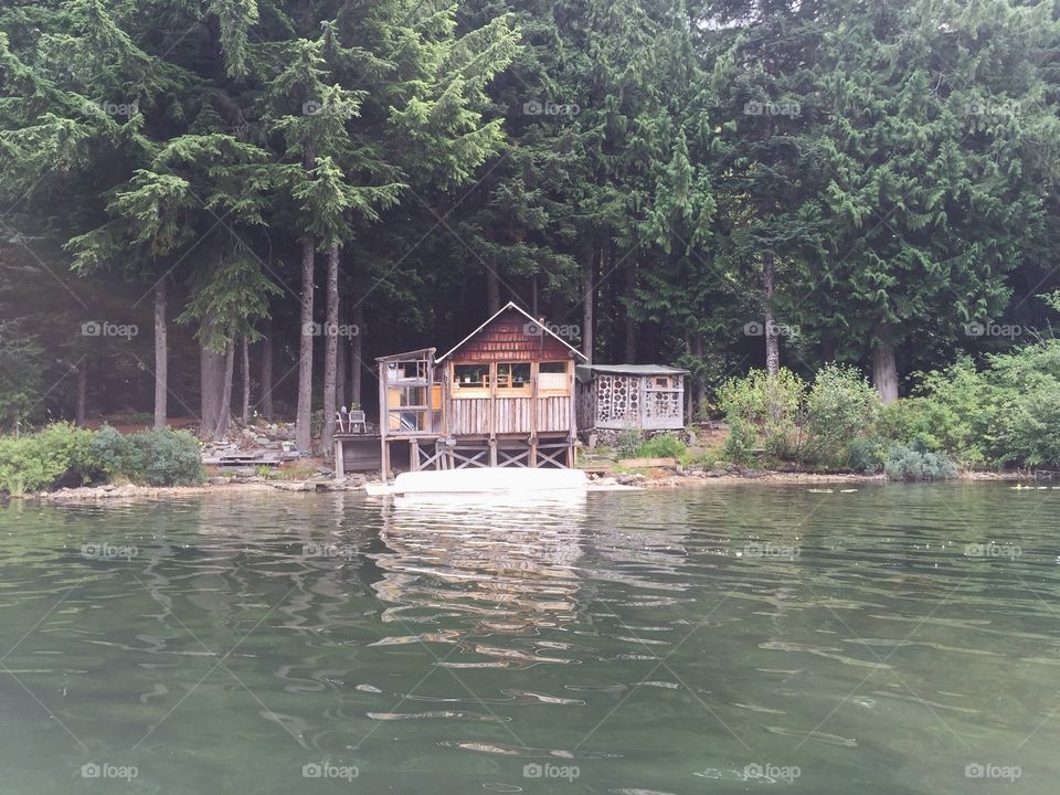 Rustic wood cabin on the lake