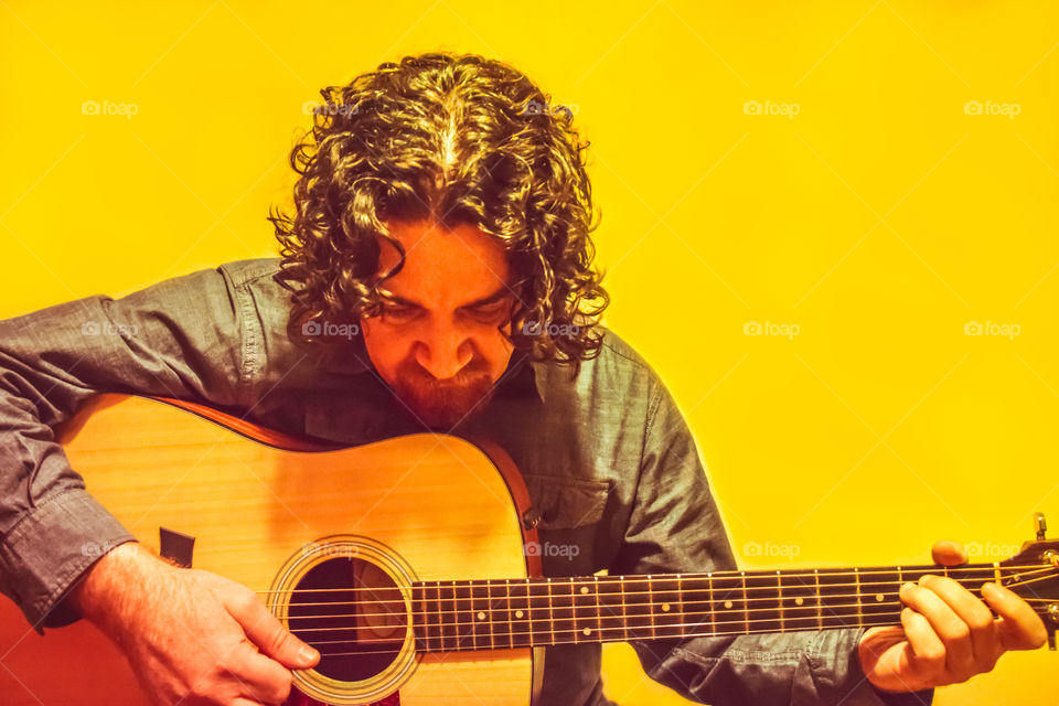 Man Playing Acoustic Guitar
