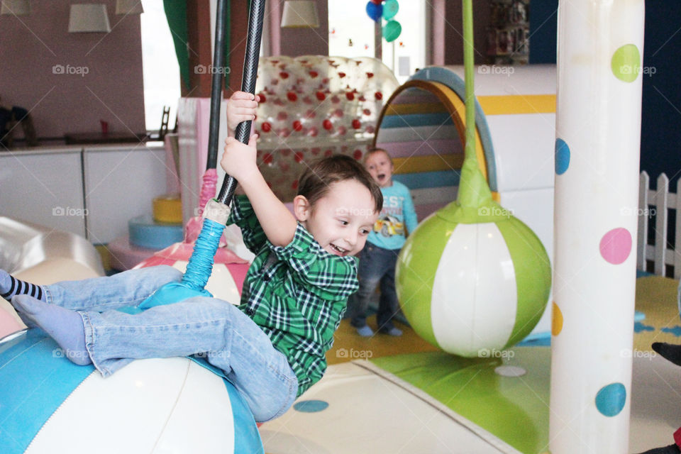 A child is having fun in the game room