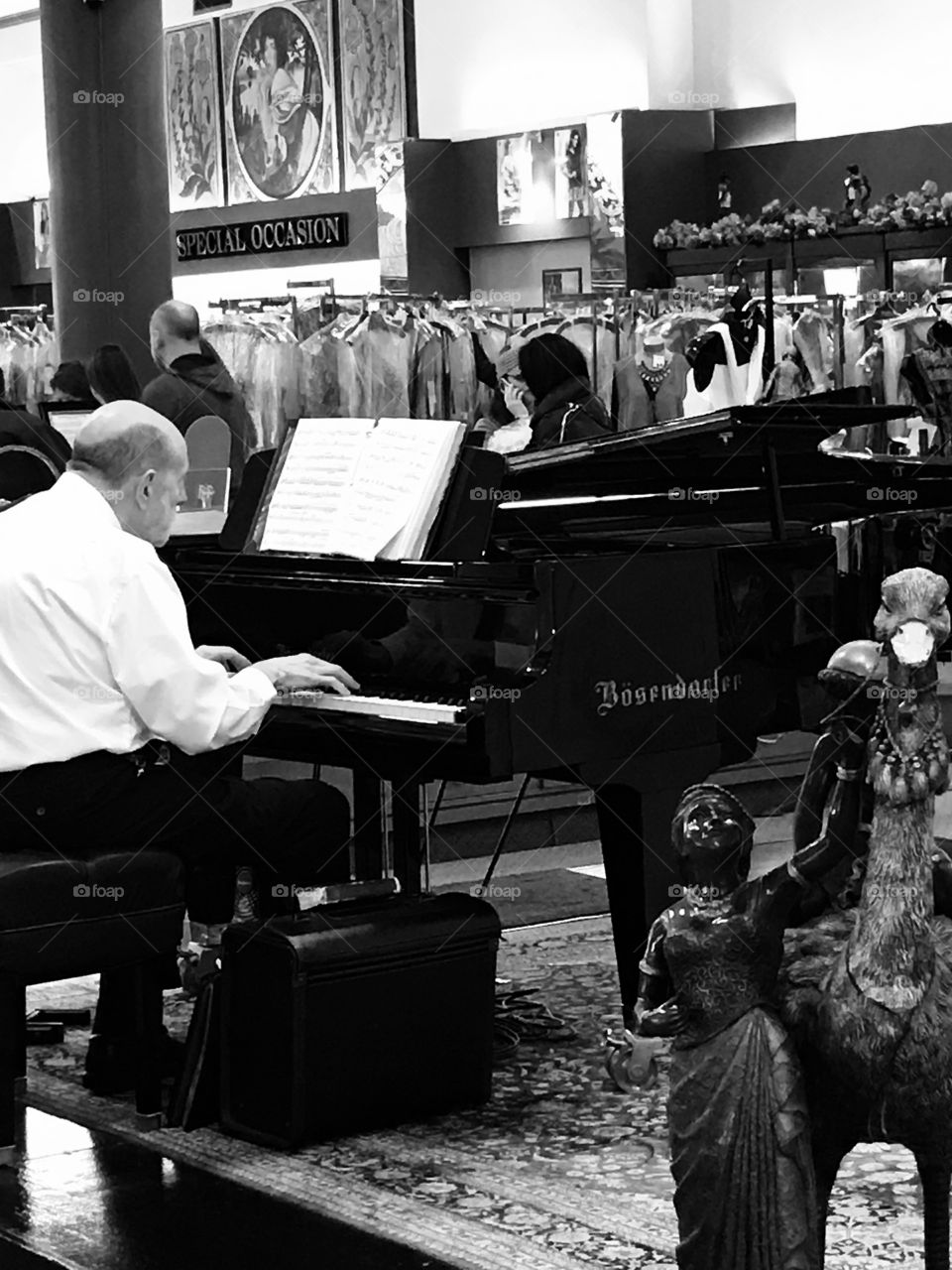 Piano Player in Dress Shop