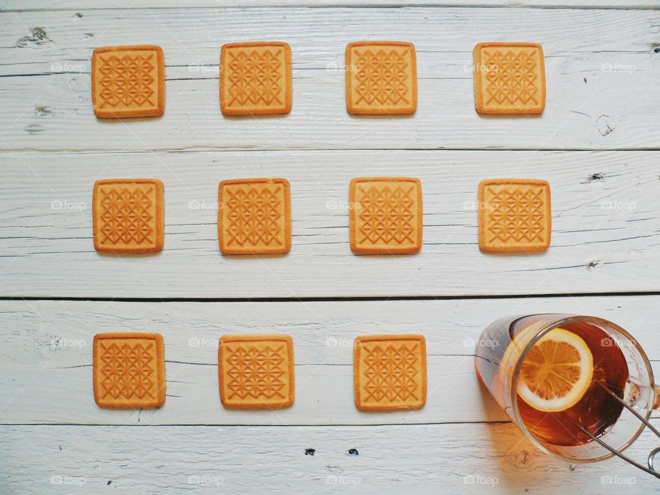 A cup of tea with lemon and homemade cookies