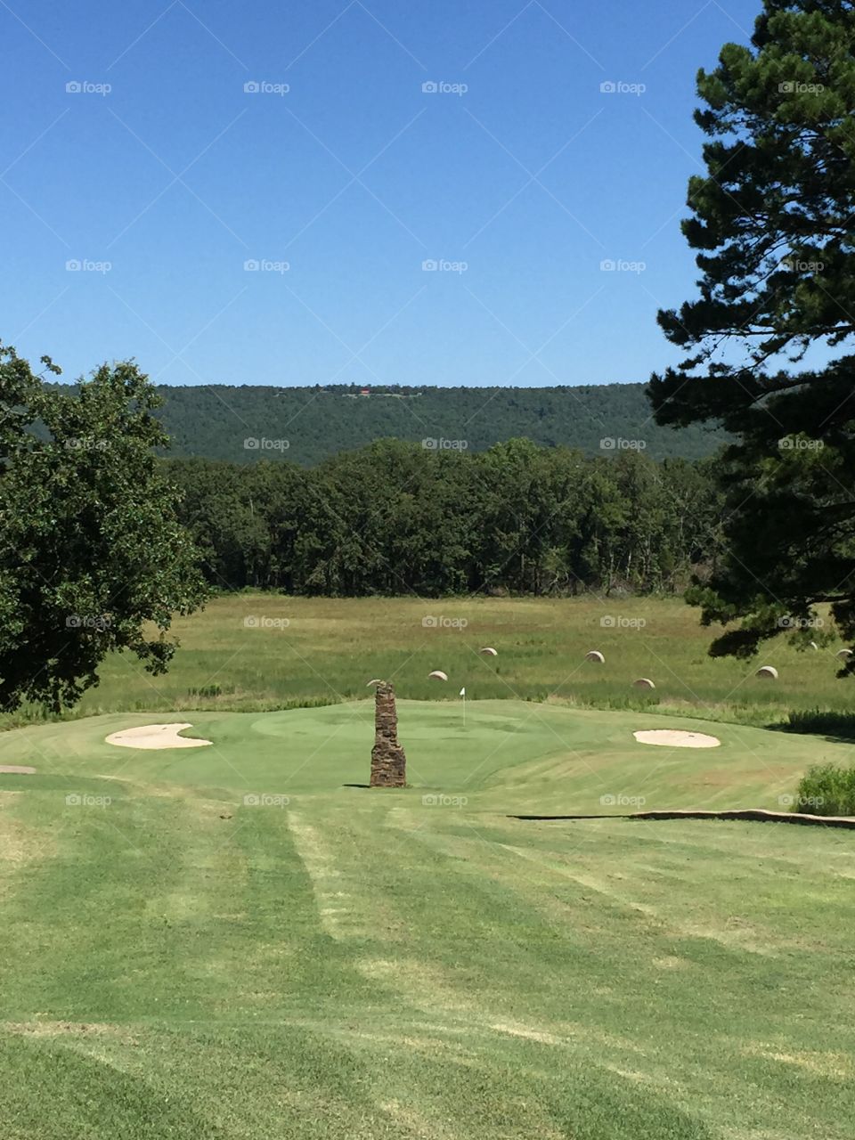 Chimney hole at Chamberlyne . This little par 3 shooting over the old homestead chimney is a difficult but beautiful hole 