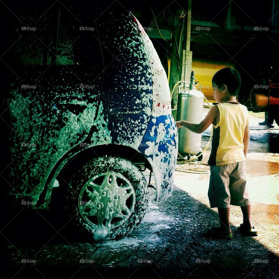 My son playing in car wash