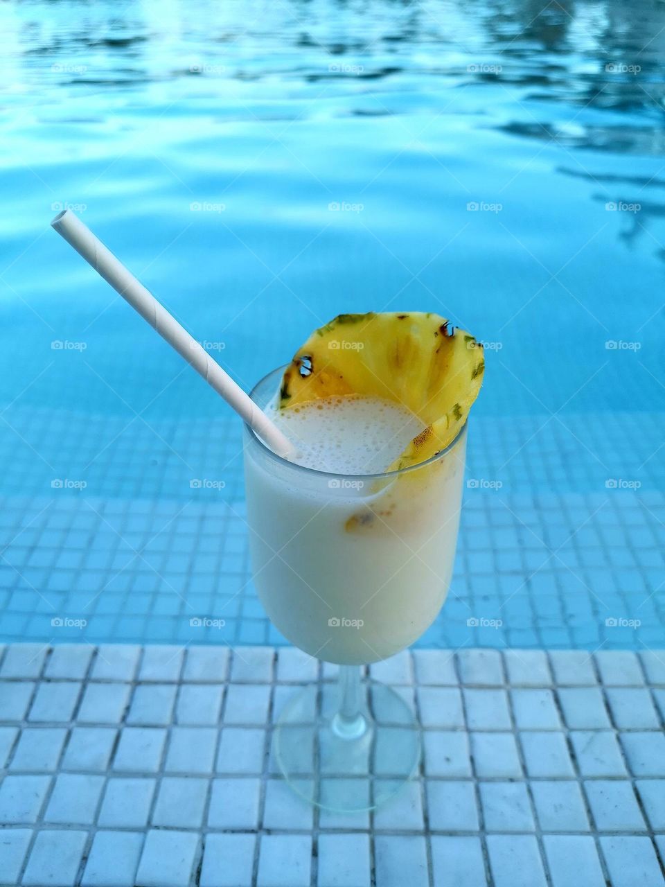 Relax and enjoy your holiday time in the swimming pool area with tasty pinacolada.