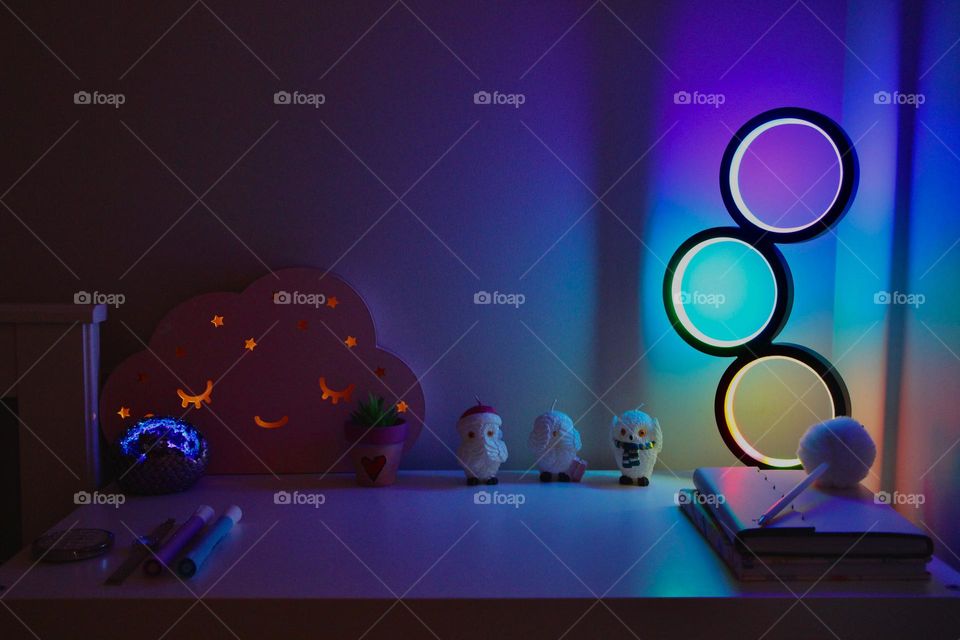 A cutesy and safe workspace for the creative minds.  The fluorescent lights up the area with a cheery, imaginative aura.