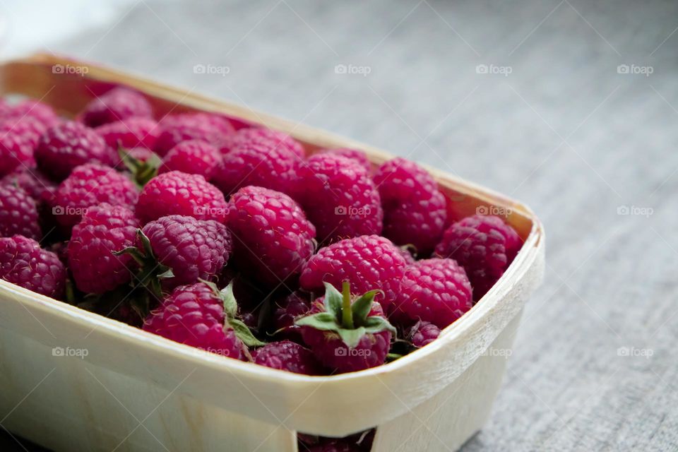 Close up of basket with raspberries