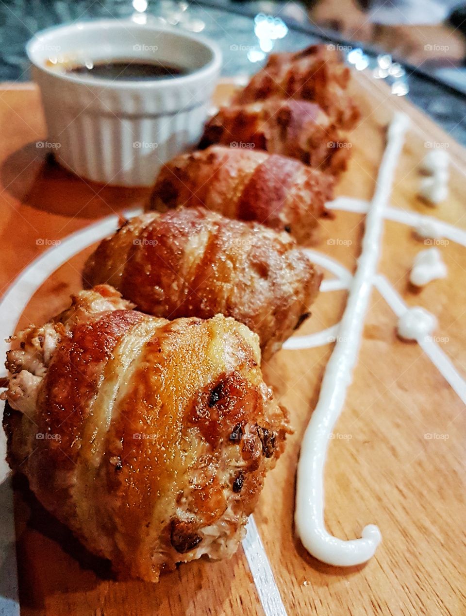 quail egg and meat wrapped in bacon