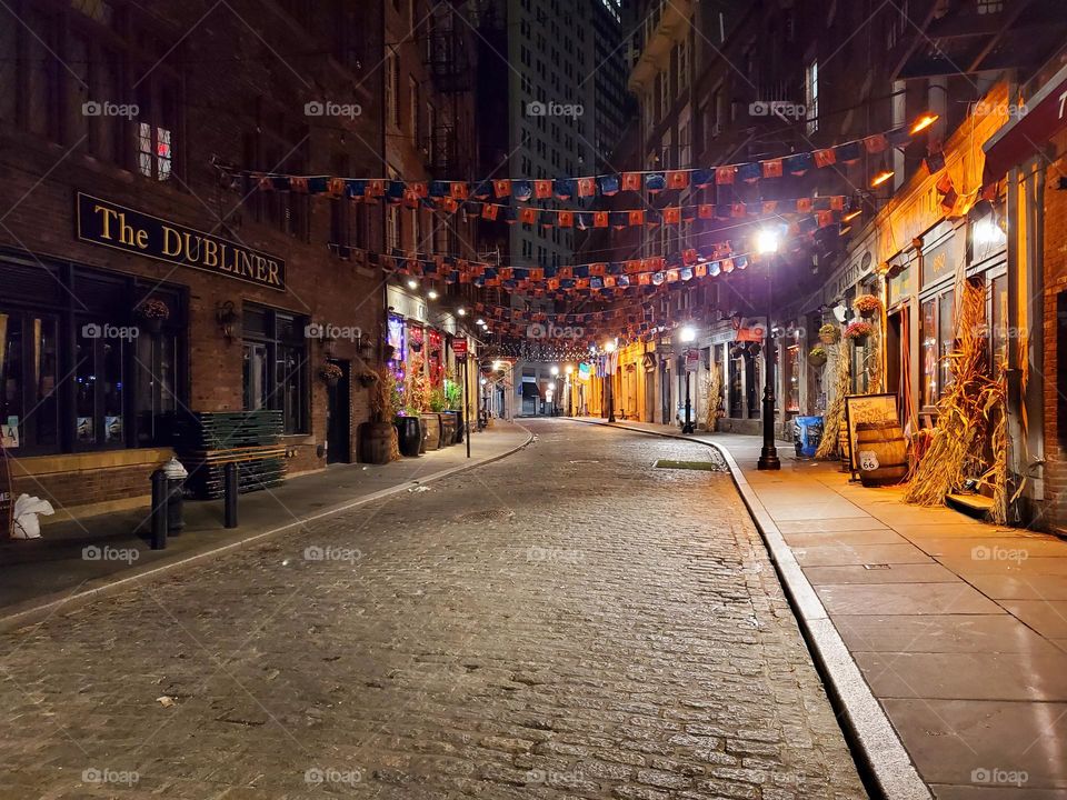 A night time street scene in New York City on a eerily deserted street
