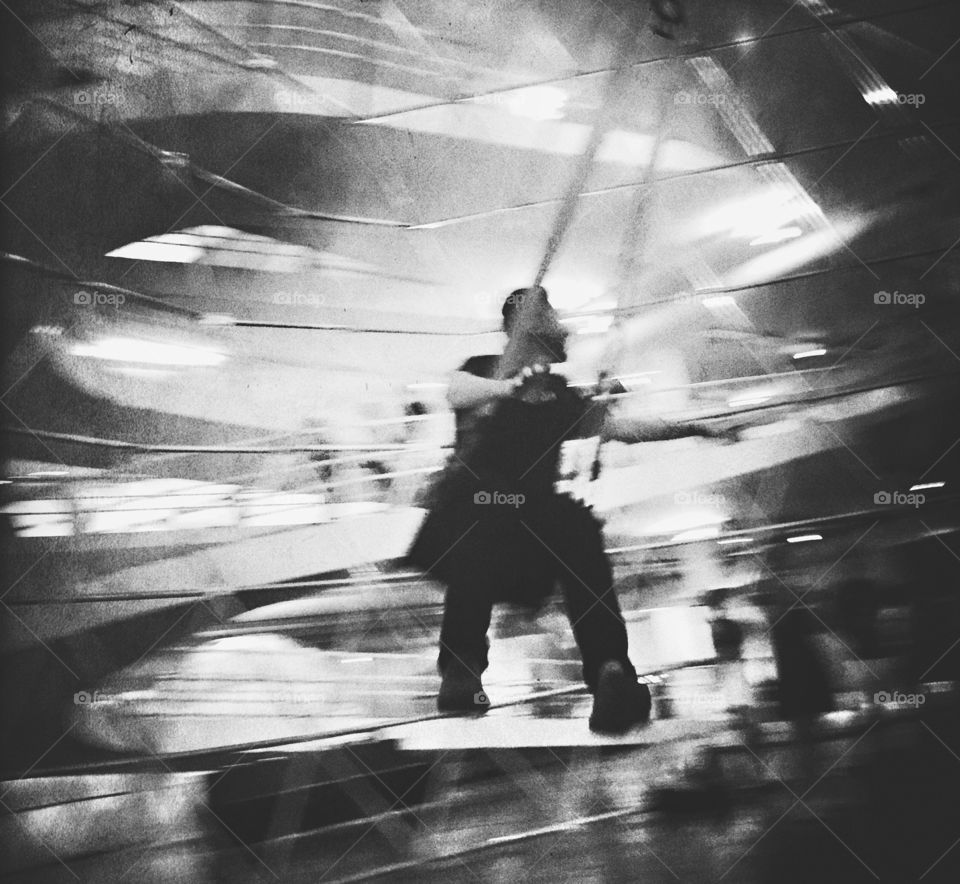 Man flying in rocking chair 