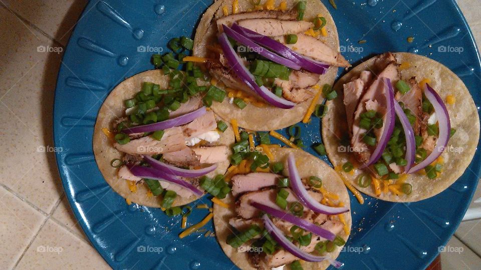 Green and red onion chicken tacos. At home cooking a very delicious healthy meal