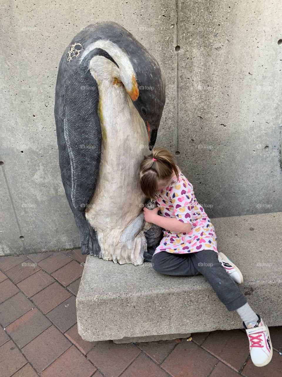 Little girl with Down syndrome loves penguins