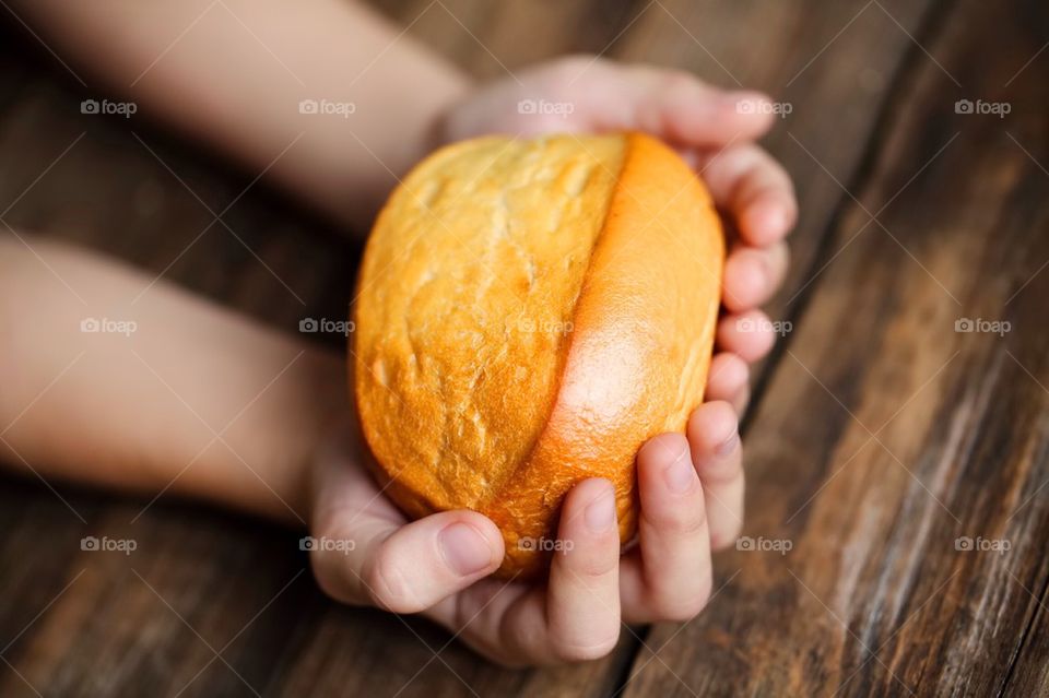 Boy holding bakery food