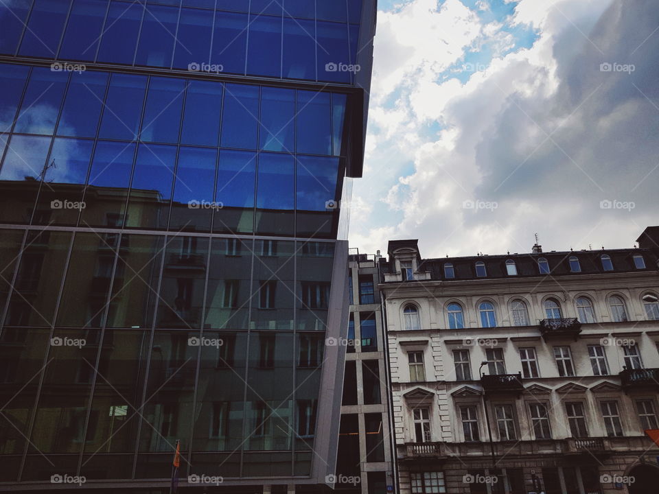 Glass exterior of buildings with reflections in Warsaw.