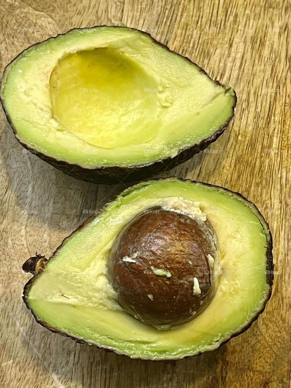 Close-up shot of an avocado cut into two halves.