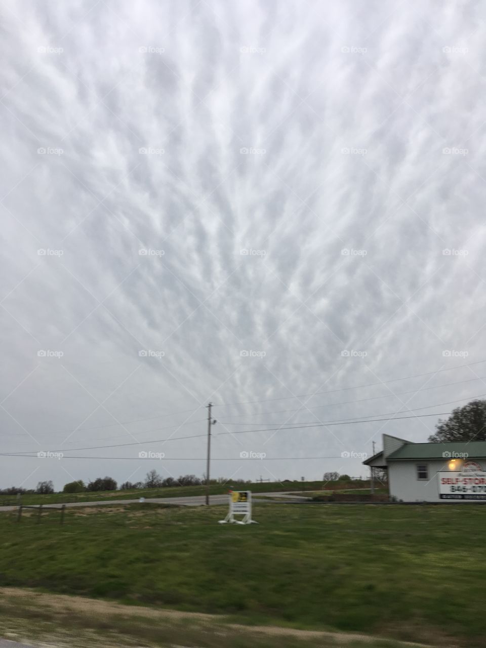 A spray of grey clouds looks as if they’re in an upwards positions. Gods artwork!