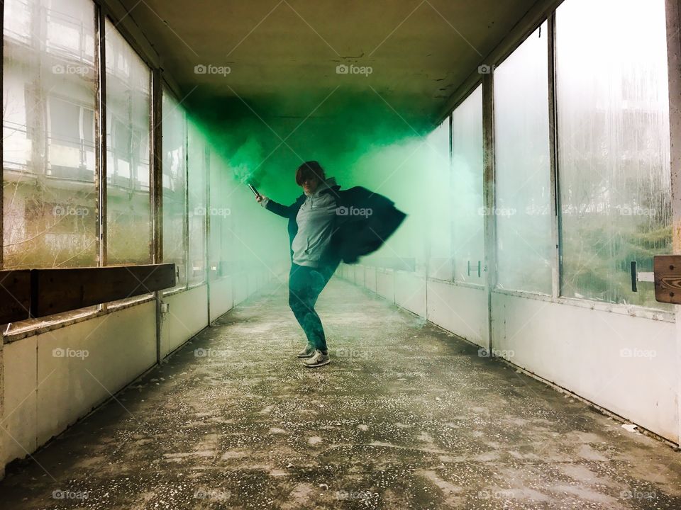 A person holding smoke bomb