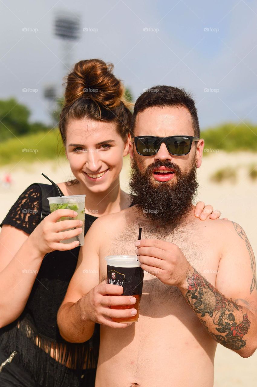 man and woman engoying hot summer day on the beach