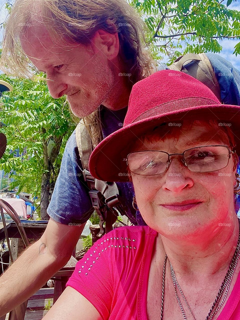 Still happy together after all these years we, „Petra Schiller“ and partner „Timothy Trespas“ sit down for a moment on the homemade veranda next to our boat, the „Salvation“ at „Newtown Creek“ in LIC, Queens. 2023. Hypnotic Productions